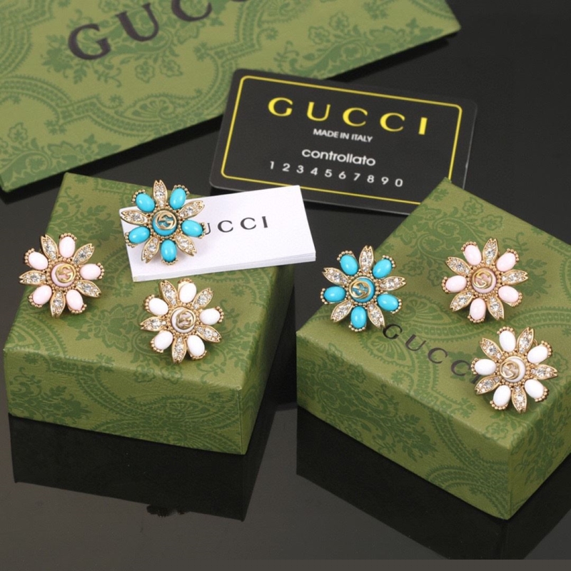 G*u*i earrings